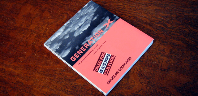 Cover buku Generation X yang ada di atas meja kayu dengan potret awan dan kotak pink